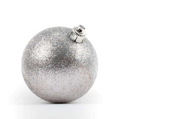 istock Festive background. On a gray background, a silver Christmas round ball. 1473700918