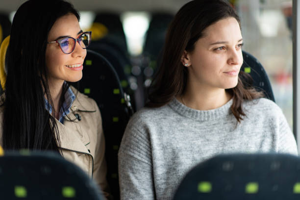 istock Two female friends traveling by bus 1473701410