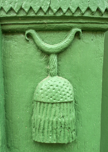 Carving Details on Green Door of an Old House