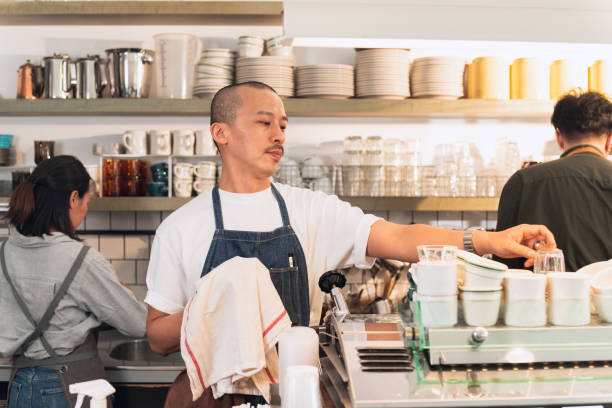 istock Barista tidy up before opening 1473701842