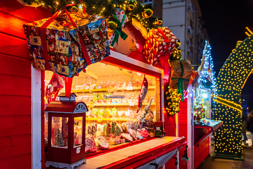 Craiova, Romania. Famous Christmas Market, european top 2022 winter destination in Eastern Europe, historical Oltenia. Wooden kiosk with Xmas decorations.