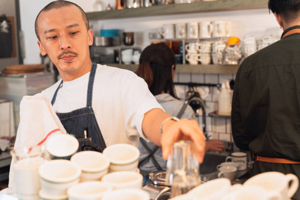 istock Barista tidy up before opening 1473703035