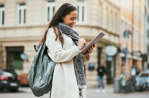 Marketing, digital writing and tablet blog woman travel journalist working on street for city story. Social media, happy and young urban reporter outdoor from Spain happy about creative job vision