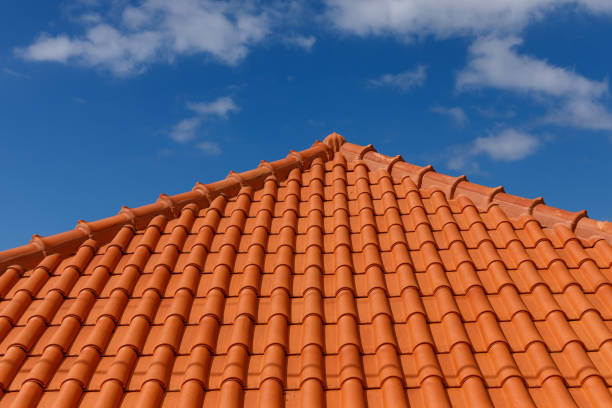 istock Red tiles panels roof under blue sky. 1473705138