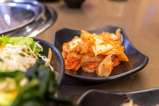 Close up of a bowl of kimchi - traditional korean fermented probiotic food