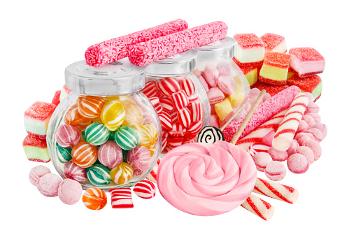 Glass jars with different candies on white background, collage