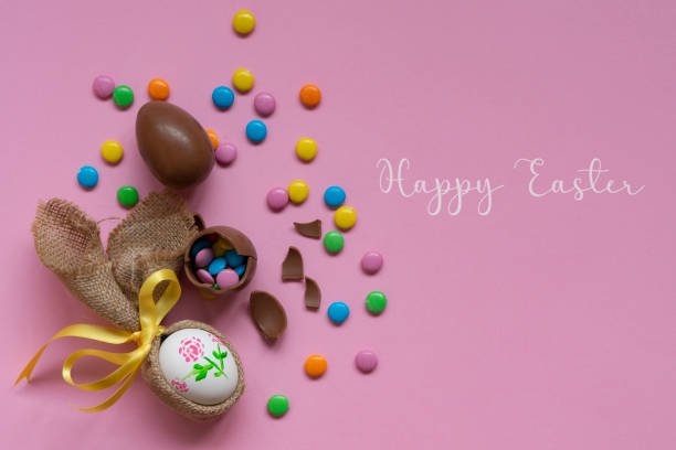 istock Easter chocolate eggs and candies on a pink background 1473706988