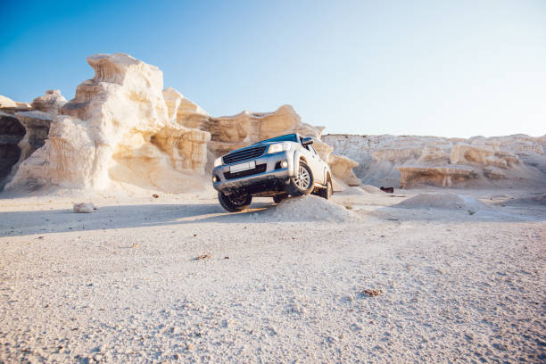 istock Vehicle standing in sandy valley in daylight 1473708566