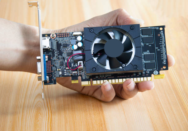 istock side view of computer graphics card holding in hand 1473709587