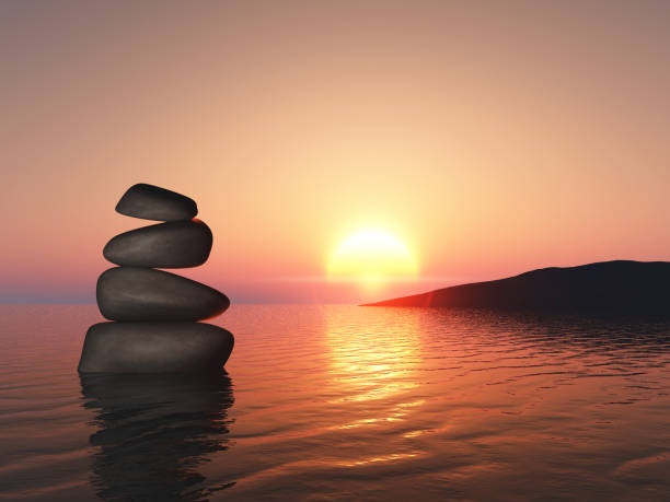 istock 3D landscape with balancing pebbles in sunset sea 1473709702