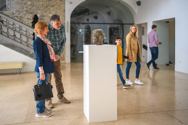 retired caucasian art historians on a date - pedestal collection showing old imagens e fotografias de stock