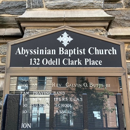 New York, NY USA - September 28, 2022 : A black board with the schedule for Sunday worship services led by Reverend Calvin O. Butts III at the Abyssinian Baptist Church at 132 Odell Clark Place