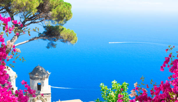 Ravello village, Amalfi coast of Italy Belltower in Ravello village with sea view with flowers, Amalfi coast of Italy ravello stock pictures, royalty-free photos & images