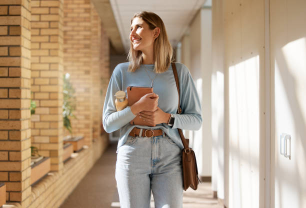 istock Education, learning and woman with smile for college, thinking and studying for future on campus. University, happy and student with an idea for higher education at an academy on a study scholarship 1473711534