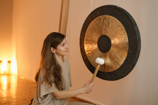 istock Woman playing a gong 1473712981