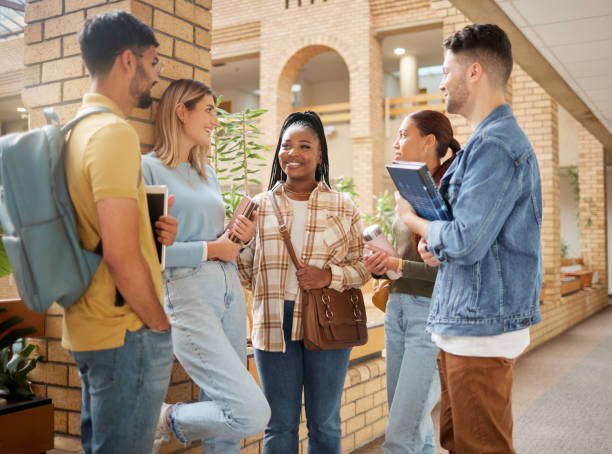 istock Learning, friends and college with students happy on campus with books for education, scholarship or knowledge. Study, future or university with people for back to school, academy or exam goals 1473716749