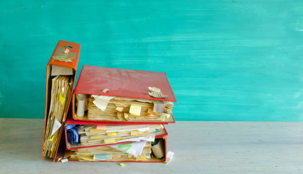 istock Messy file folders, red tape, bureaucracy, business concept, free copy space 1473717599