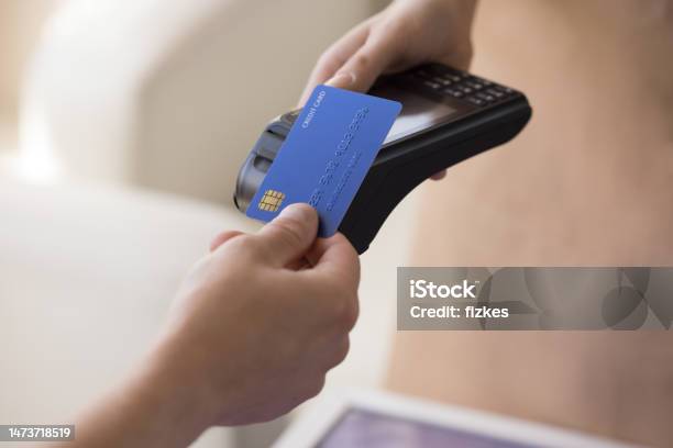 Hand Of Bank Cardholder Paying Bill In Cafe Stock Photo - Download Image Now - Credit Card, Paying, Wages