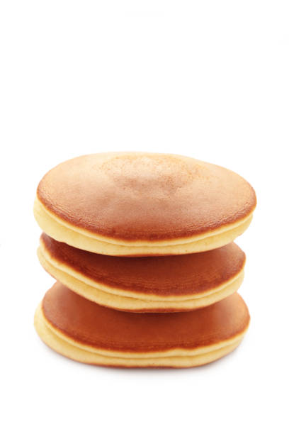 istock Stack of delicious pancakes isolated on white background. 1473719934