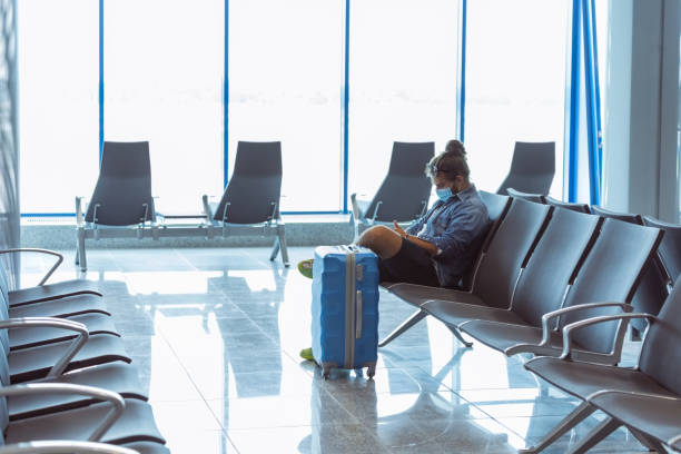 istock Young man waiting for the flight at the airport 1473723615