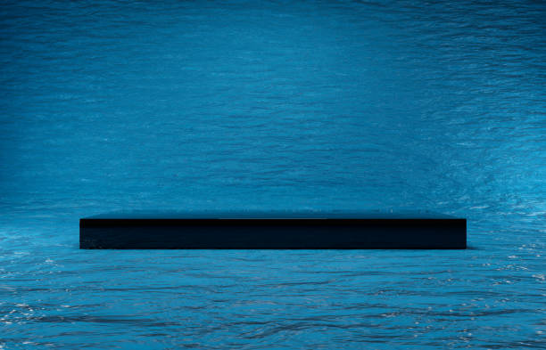 istock Black gloss podium or pedestal display on blue water background with long platform. Blank product shelf standing backdrop. 3D rendered, three point lighting. 1473724443
