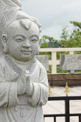 Child stone carving at Indonesia budhist temple