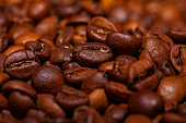 istock Coffee beans close up background 1473730320