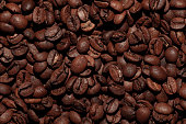 istock Coffee beans close up background 1473730328