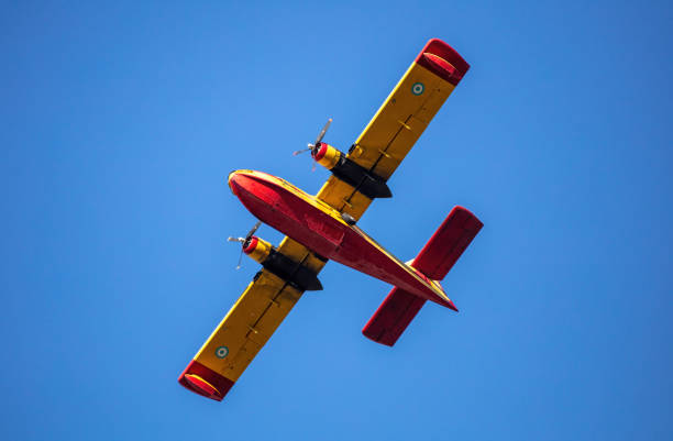 istock Canadair flight, Firefight Aircraft, scooper flying on blue sky, under view. 1473730682