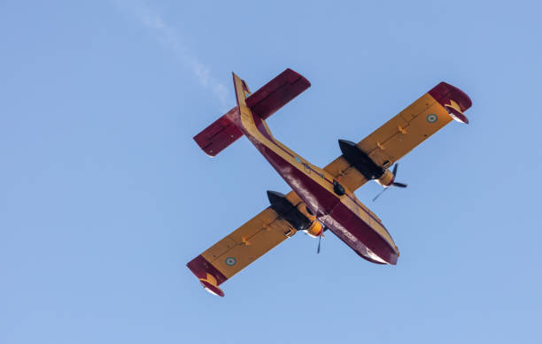 istock Canadair flight, Firefight Aircraft, scooper flying on blue sky, under view. 1473730708