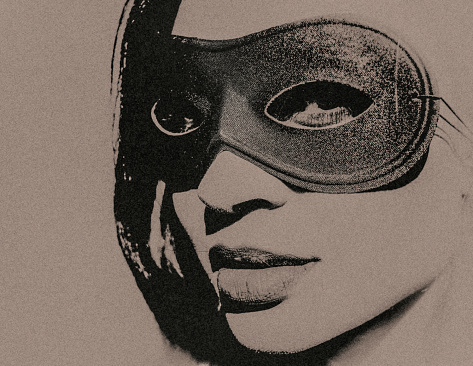 The mysterious face of a masked young woman.