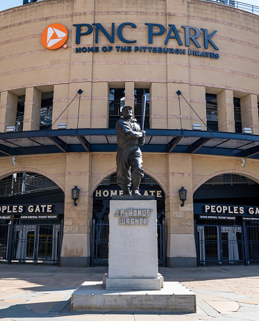 Pittsburgh, Pennsylvania, USA March 5, 2023 The Honus Wagner statue outside of PNC Park where the Pittsburgh Pirates play baseball as seen on a sunny winter day