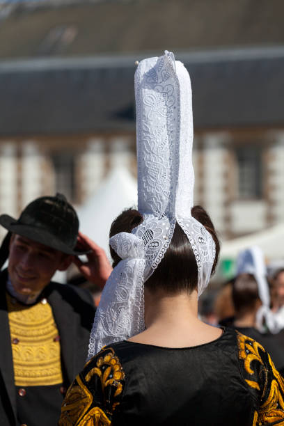 Morlaix, France - July 18 2021: Breton dancers in traditional costume and headdresses.