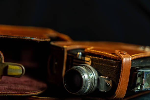 istock Vintage film camera with black background 1473737852