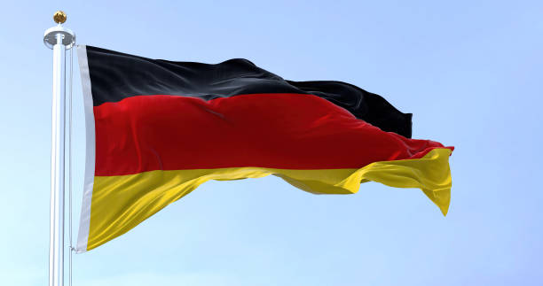 istock Germany national flag waving in the wind on a clear day 1473739578