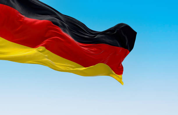 istock Germany national flag waving in the wind on a clear day 1473739625