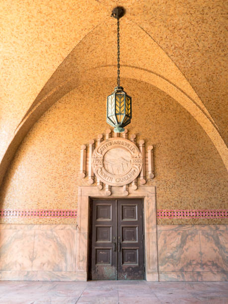 Arched entrance to Asheville City Hall, North Carolina, with the Great Seal in stone  above the heavy wood doors stock photo