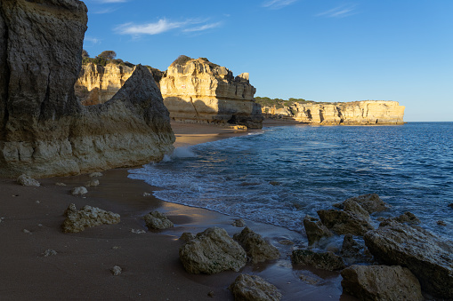 Landscape of Coelho y Mare beaches and cliffs in the Algave region at sunset. Portugal