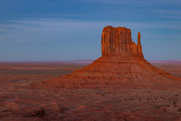 Monument Valley Landscape at Sunset - West Mitten Butte A picture of the West Mitten Butte rock formation of Monument Valley, at sunset. west mitten stock pictures, royalty-free photos & images