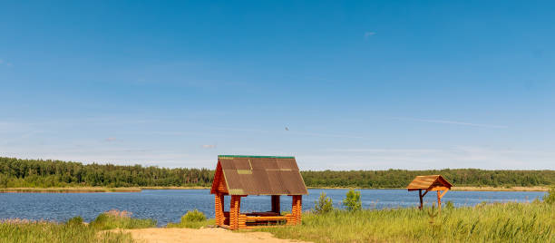 istock Gazebo for relaxing on the lakeside on a clear summer day 1473750748
