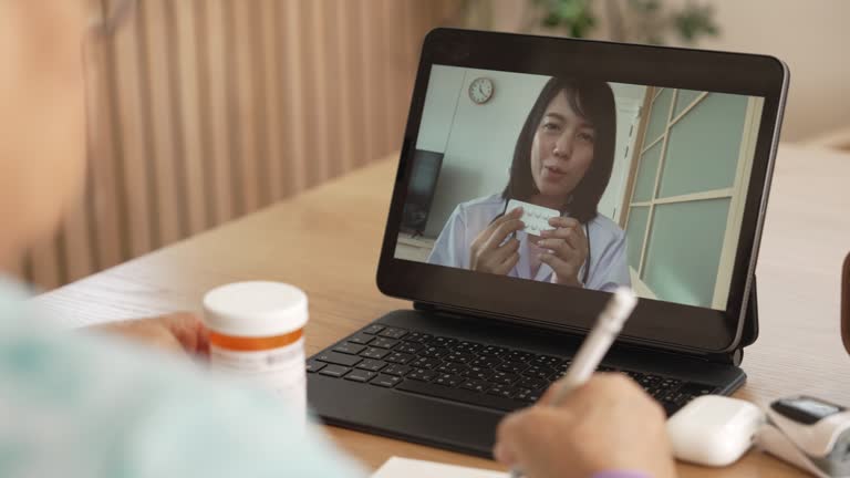 Senior woman video calling with female healthcare person.