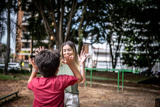 Mother and son celebrating in a park
