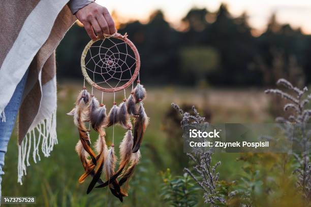 Woman With Poncho Holding Dreamcatcher Outdoors Stock Photo - Download Image Now - Dreamcatcher, Circle, One Woman Only