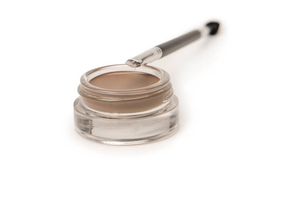 istock A brow pomade in blonde shade with brush isolated on a white background. 1473757767