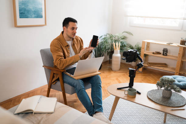 istock Technology vlogger recording new smart phone review 1473757919