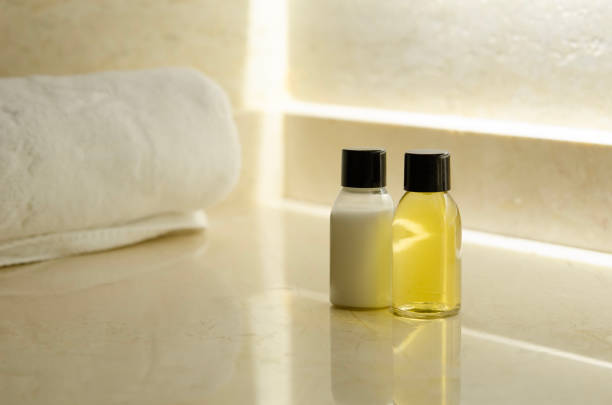 Containers with shampoo and hair conditioner. stock photo