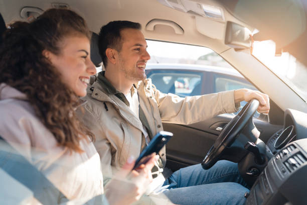 istock Young Caucasian couple driving in their car 1473759517