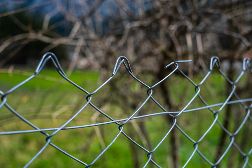 An electrical fence on a green field
