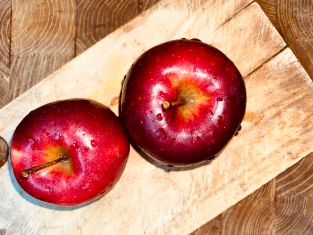 istock Two ripe and juicy red organic apples 1473760816