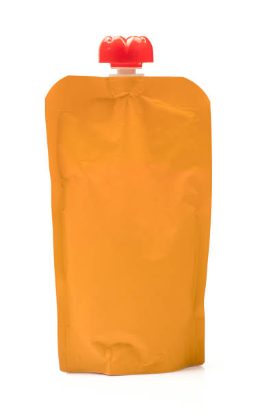 istock Single blank orange colored puree bag. Liquid container packaging isolated on white background 1473761009